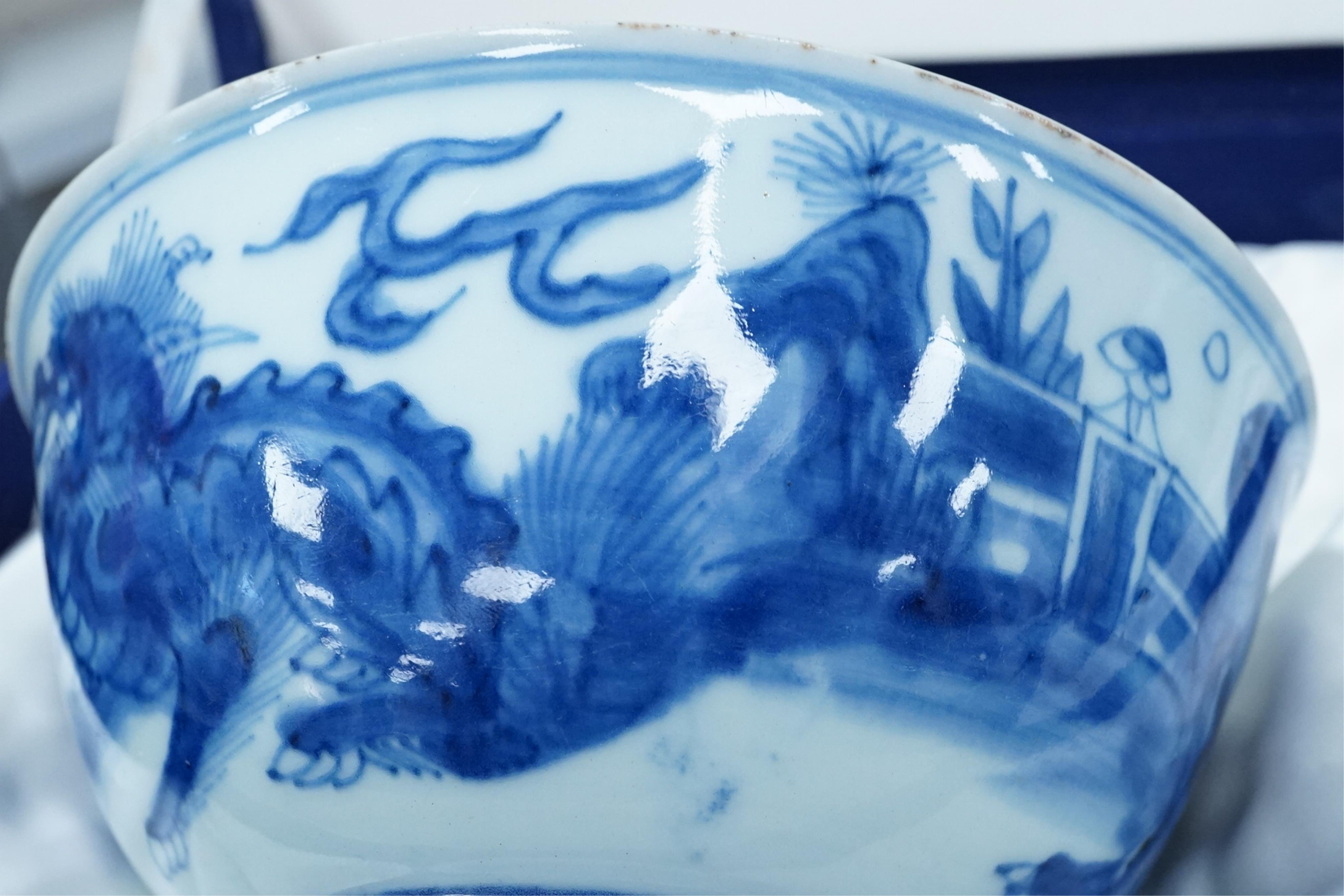 A pair of Chinese Transitional blue and white 'mythical beasts' bowls, early Kangxi period